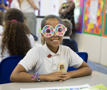 Girl wearing Global Goals Glasses